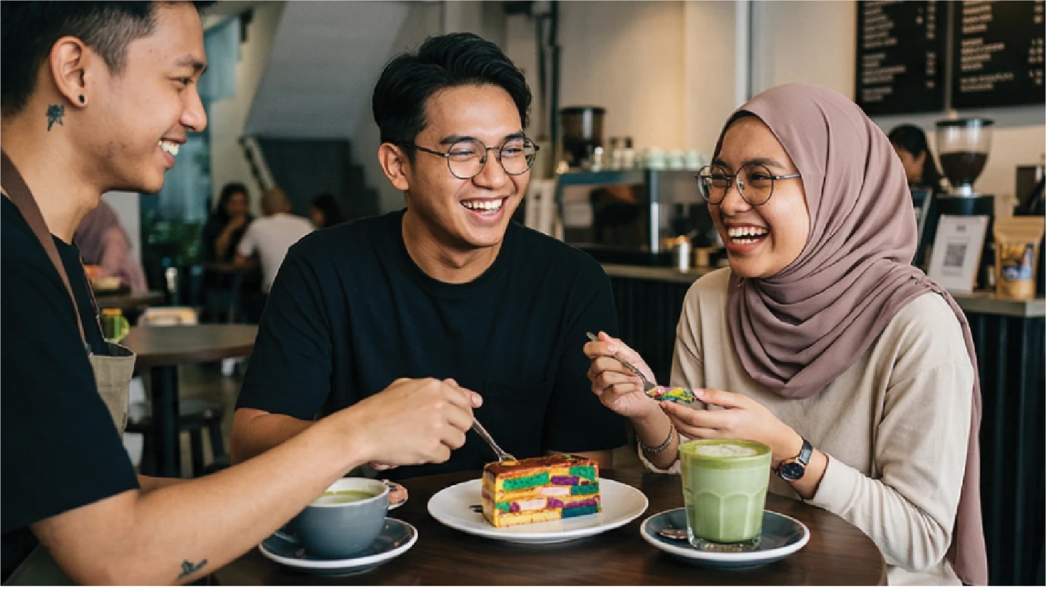 Friends enjoying food and drinks at a café in Tanjong Malim